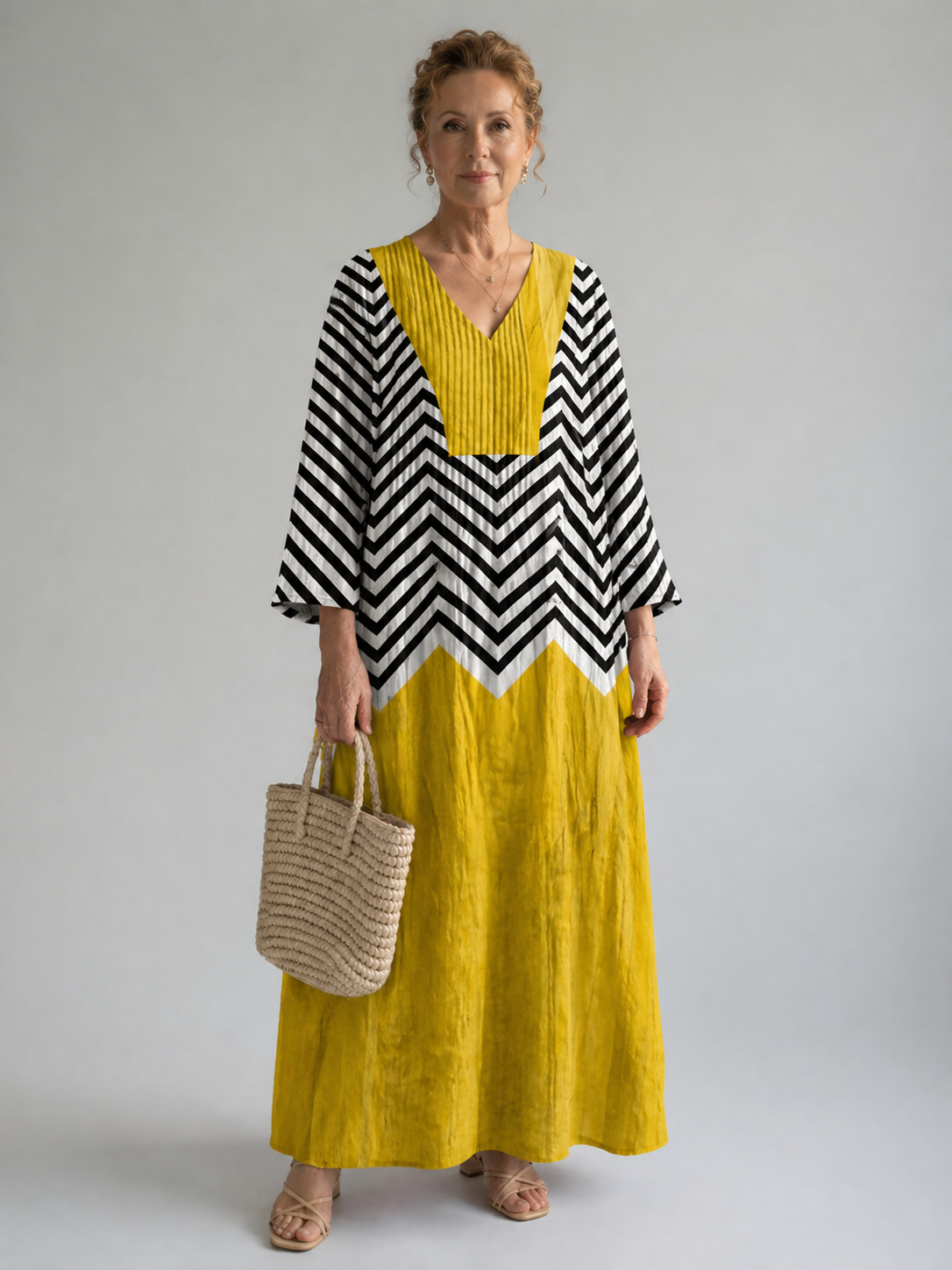 Elegant geometric dress by THE WHITMORE FAMILY featuring a stylish design and flattering fit.