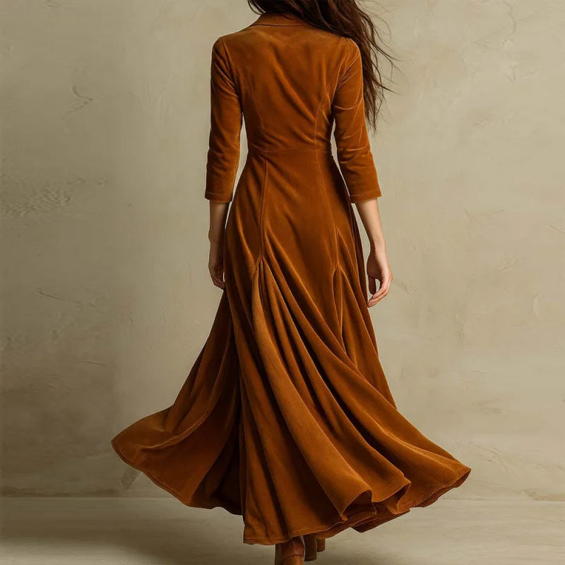 Mirella flowing velvet maxi dress by THE WHITMORE FAMILY, elegant dark velvet fabric with a flowing silhouette and long sleeves.