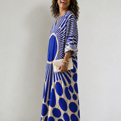 Women's Rosemary dress by THE WHITMORE FAMILY, vibrant and comfortable floral dress with a relaxed fit and colorful pattern.