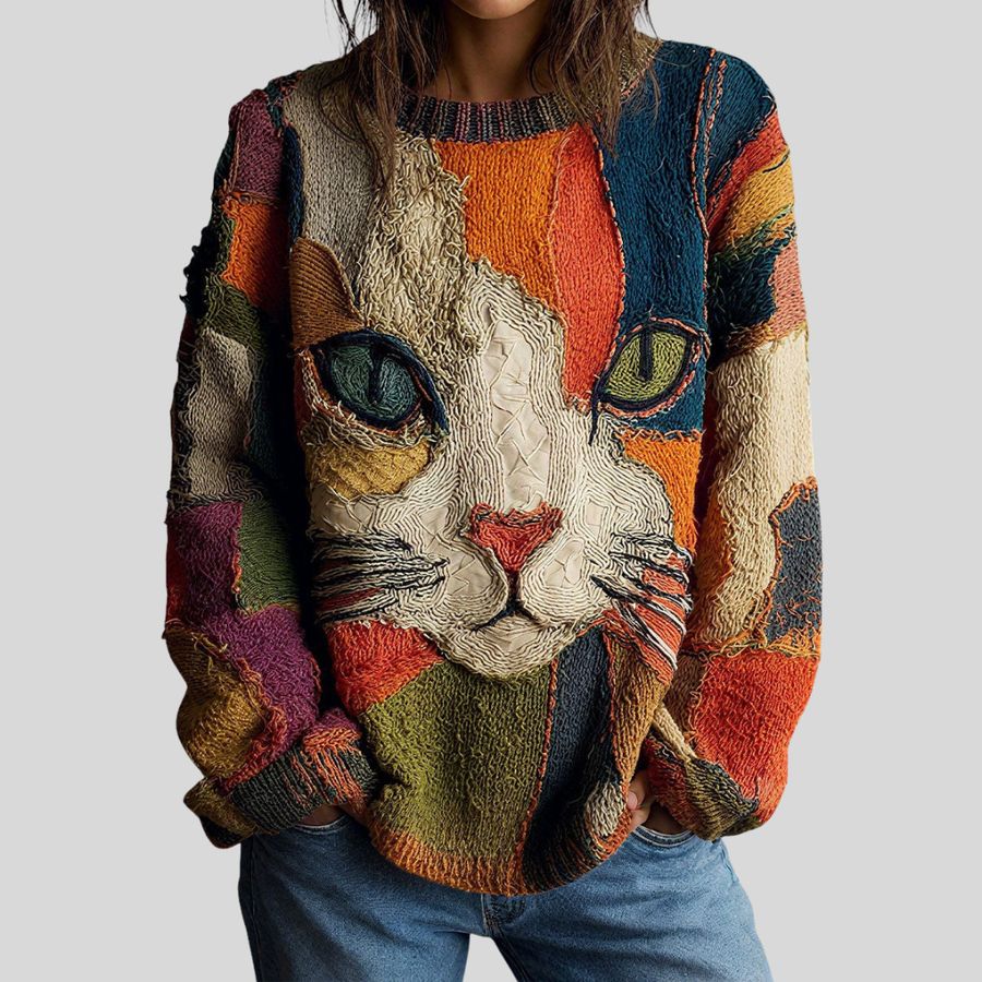 Artistic cat statement top by THE WHITMORE FAMILY, featuring vibrant cat print design on a stylish women's top.
