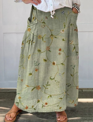 Sage green Jaizy™ retro floral art elastic waistband pocket skirt from THE WHITMORE FAMILY, featuring a stylish vintage-inspired design.