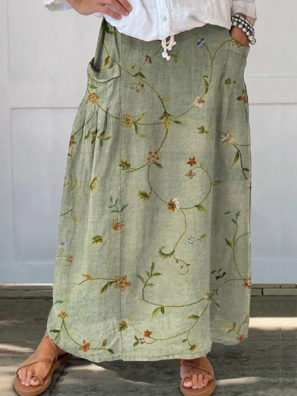 Sage green Jaizy™ retro floral art elastic waistband pocket skirt from THE WHITMORE FAMILY, featuring a stylish vintage-inspired design.