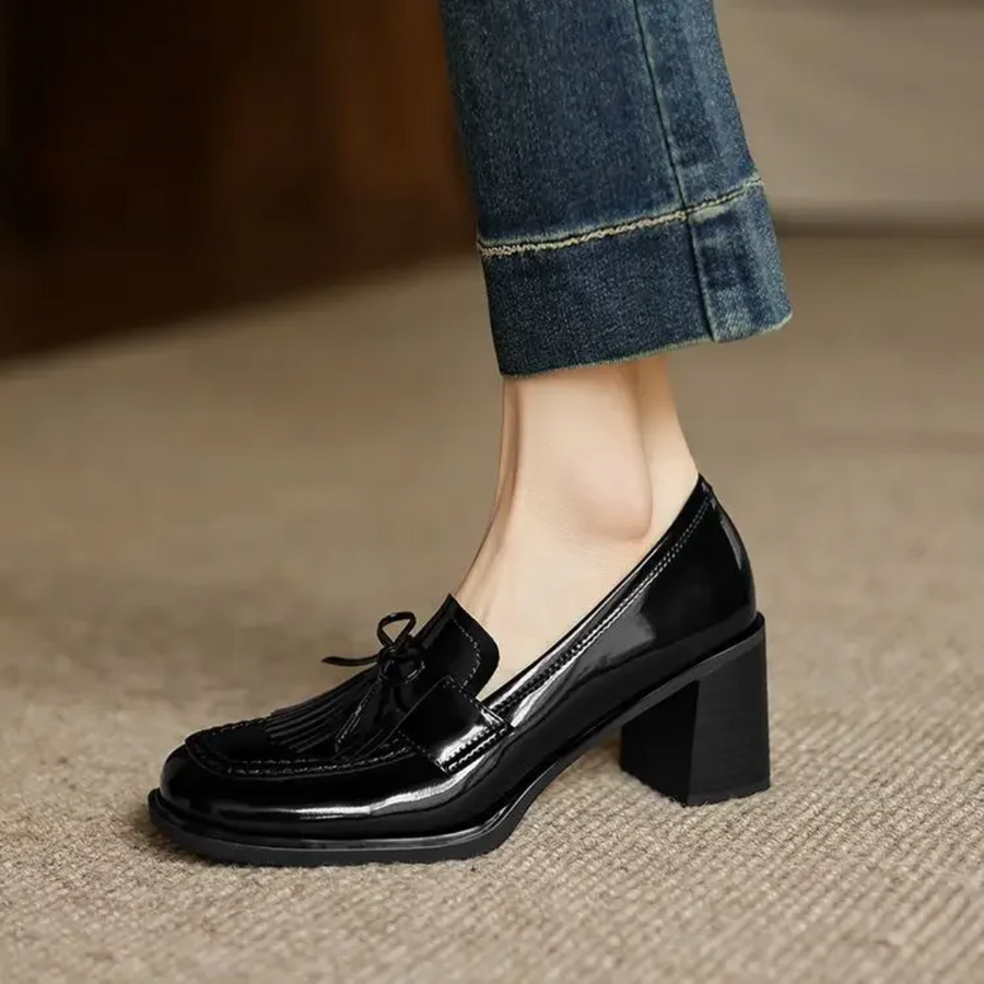 Black Dorothy loafer pumps by THE WHITMORE FAMILY, stylish sandal with a sleek design and comfortable fit.