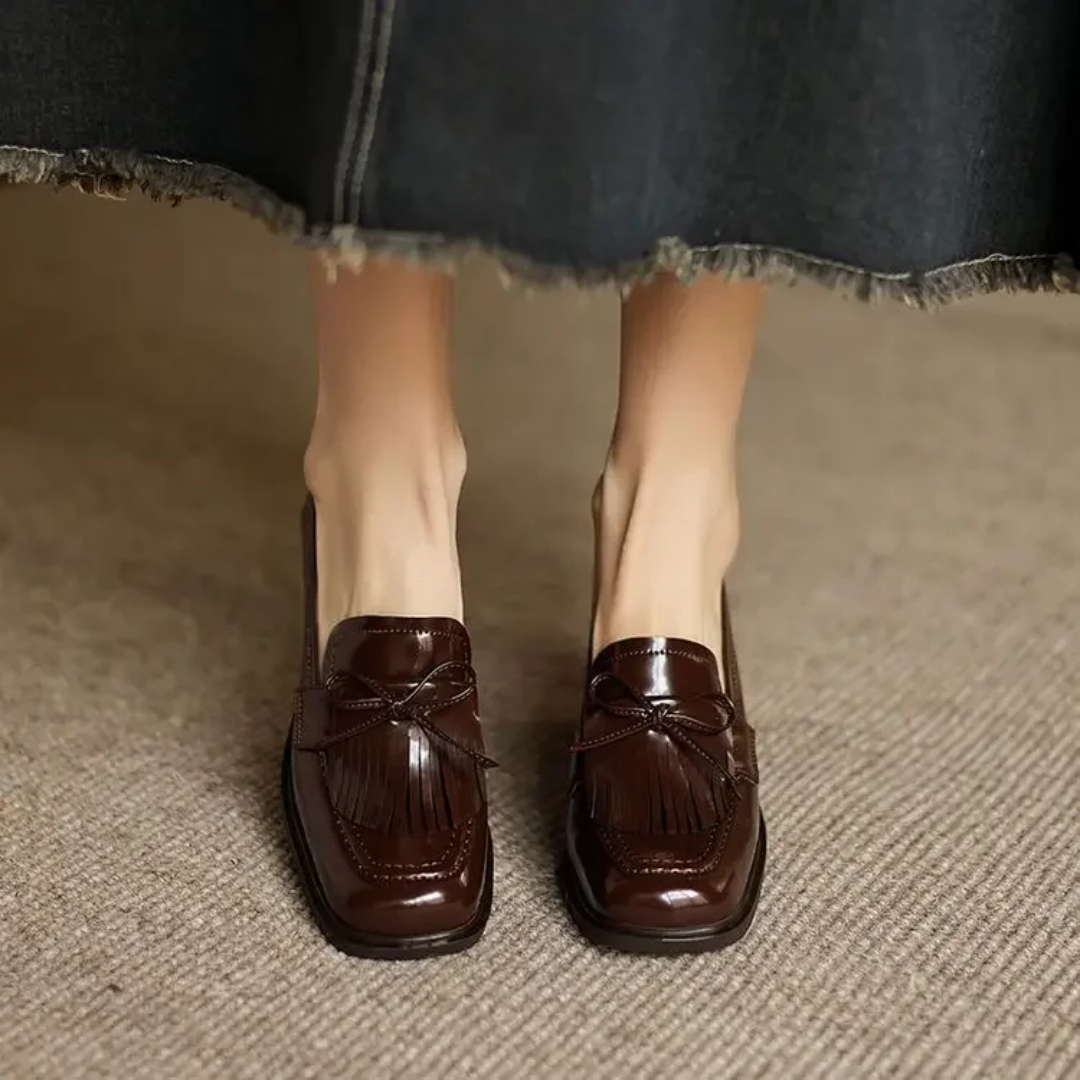 Black Dorothy loafer pumps by THE WHITMORE FAMILY, stylish slip-on sandal with a sleek design and comfortable fit.