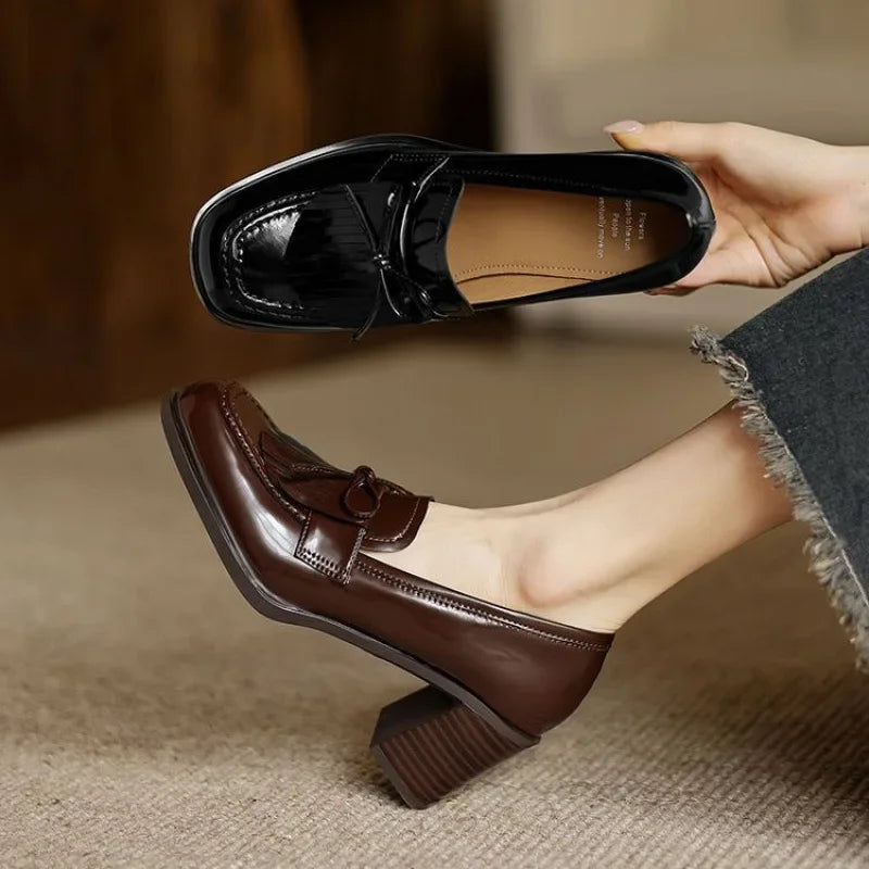 Black Dorothy loafer pumps by THE WHITMORE FAMILY, stylish slip-on sandal with a sleek design and comfortable fit.