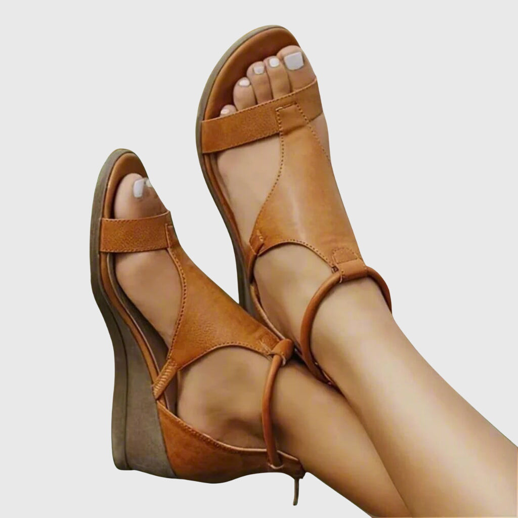 Black Rosalie™ orthopedic sandals by THE WHITMORE FAMILY, featuring supportive straps and cushioned footbed for comfort.