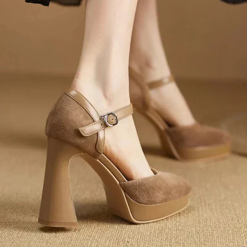 Brown Celeste Mary Jane heels by THE WHITMORE FAMILY, elegant sandal with classic strap design and comfortable heel.