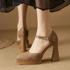 Brown Celeste Mary Jane heels by THE WHITMORE FAMILY featuring a classic sandal design and elegant strap details.