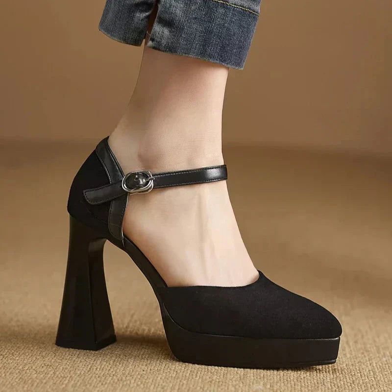 Brown Celeste Mary Jane heels by THE WHITMORE FAMILY, elegant sandal with a classic strap design and polished finish.