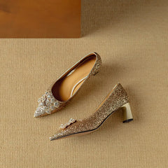 Gold glitter pumps from THE WHITMORE FAMILY Gloria sandal featuring a stylish open toe and elegant heel.
