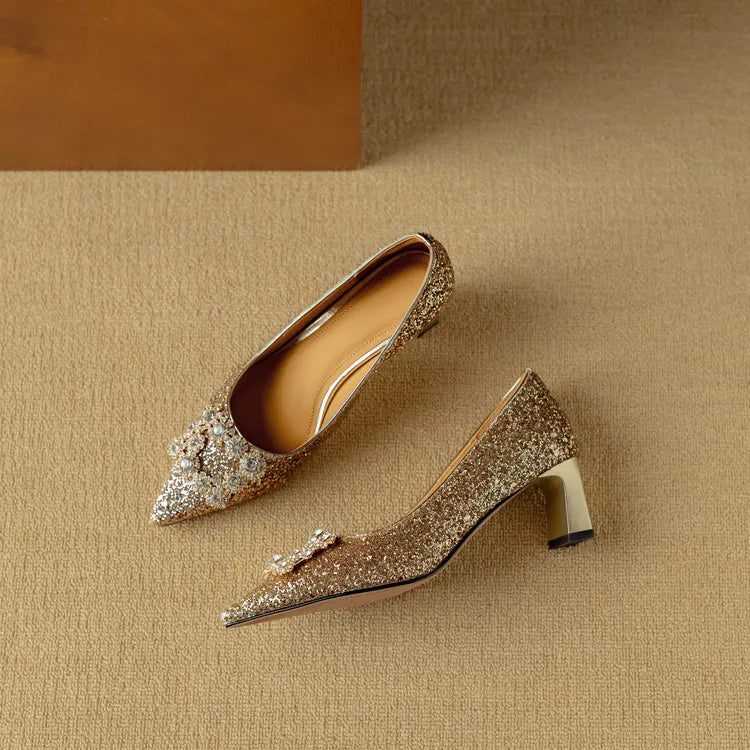 Gold glitter pumps from THE WHITMORE FAMILY Gloria sandal featuring a stylish open toe and elegant heel.