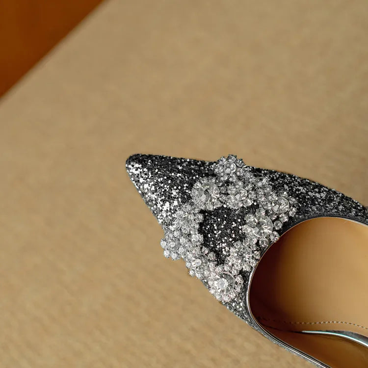 Gold glitter pumps from THE WHITMORE FAMILY Gloria sandal collection, featuring stylish slip-on design with glitter details.