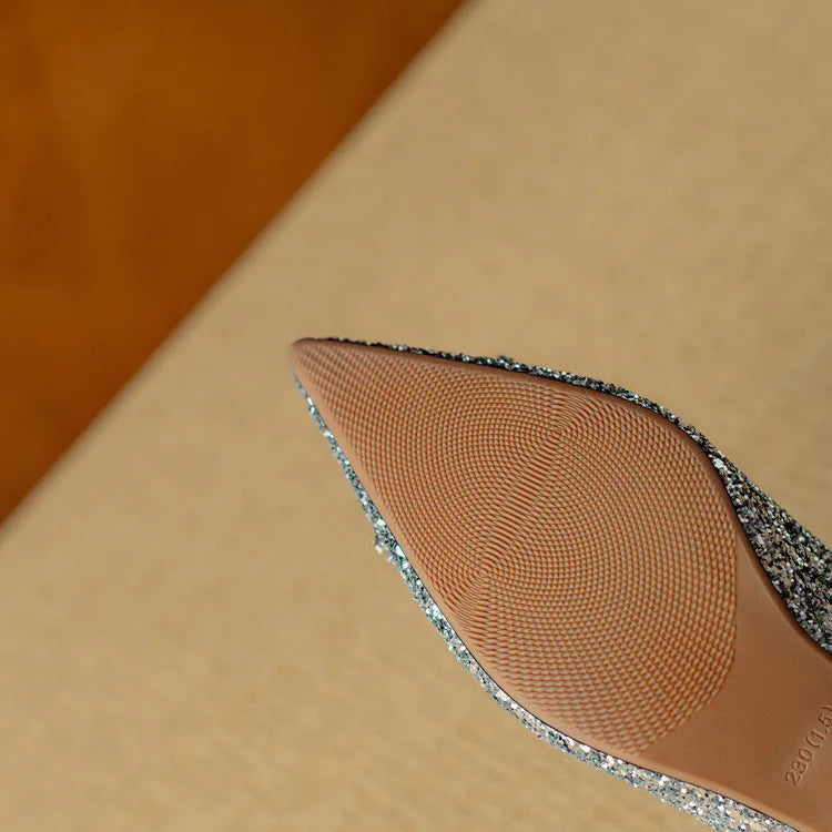 Gold glitter pumps from THE WHITMORE FAMILY featuring elegant sandal design and stylish heel for women's fashion.