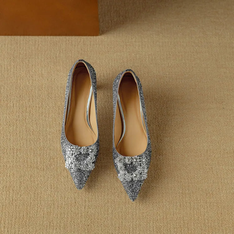 Gold glitter Gloria sandals by THE WHITMORE FAMILY with stylish open-toe design and ankle strap, perfect for dressy occasions.
