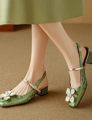 Green Diana Genine Slingback Pumps by THE WHITMORE FAMILY, stylish sandal with elegant strap detail and comfortable heel.