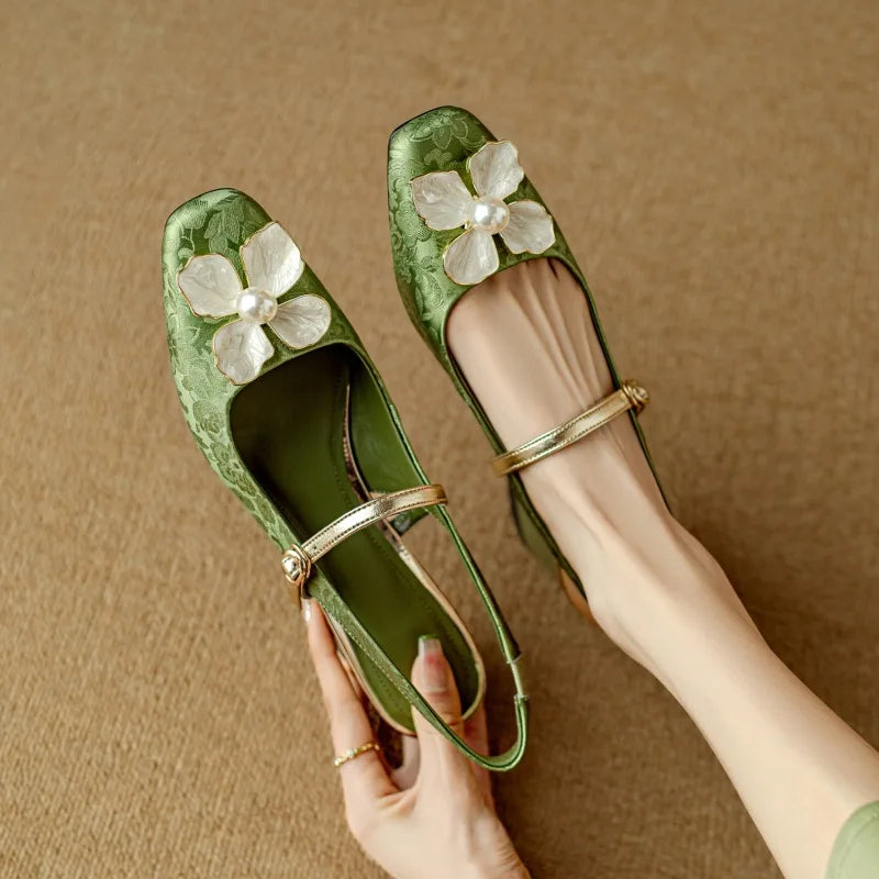 Green Diana Genine slingback pumps by THE WHITMORE FAMILY, stylish sandal with a sleek strap design and comfortable heel.