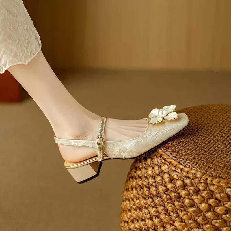 Green Diana Genine slingback pumps by THE WHITMORE FAMILY, stylish sandal with a sleek strap design and comfortable heel.
