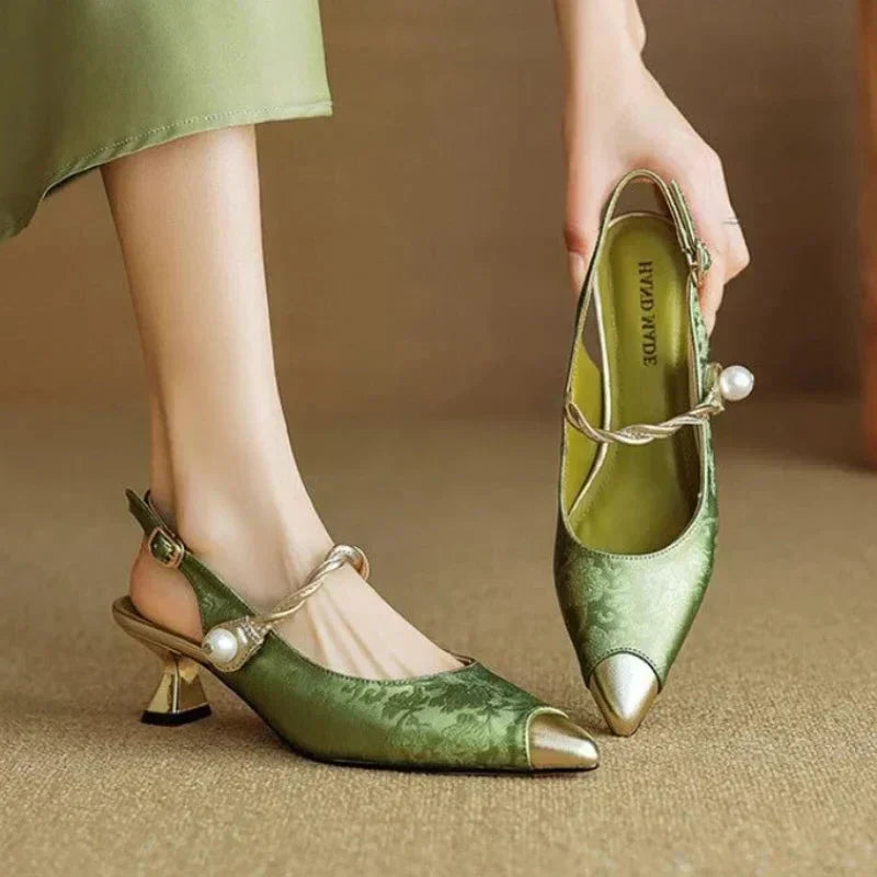Green Karen elegant sandal by THE WHITMORE FAMILY featuring a stylish, fine pump design with sleek straps and a comfortable heel.