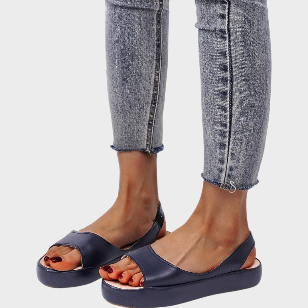 Yellow Caryzzaa™ orthopedic sandals by THE WHITMORE FAMILY, featuring supportive straps and cushioned soles for comfort.