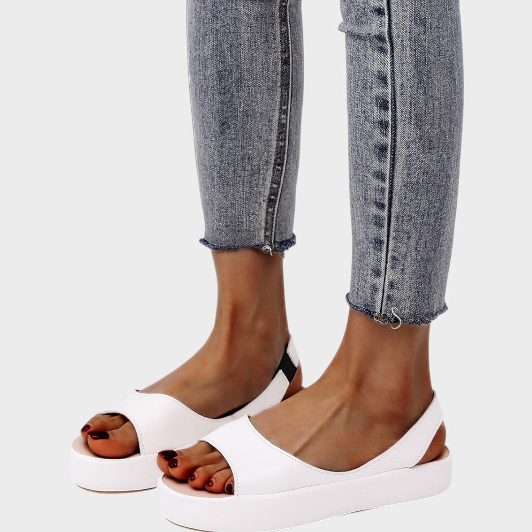 Yellow Caryzzaa™ orthopedic sandals by THE WHITMORE FAMILY featuring supportive straps and cushioned soles.