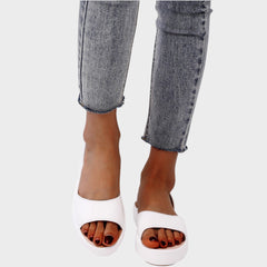 Yellow Caryzzaa™ orthopedic sandals by THE WHITMORE FAMILY with supportive straps and cushioned soles for comfort.