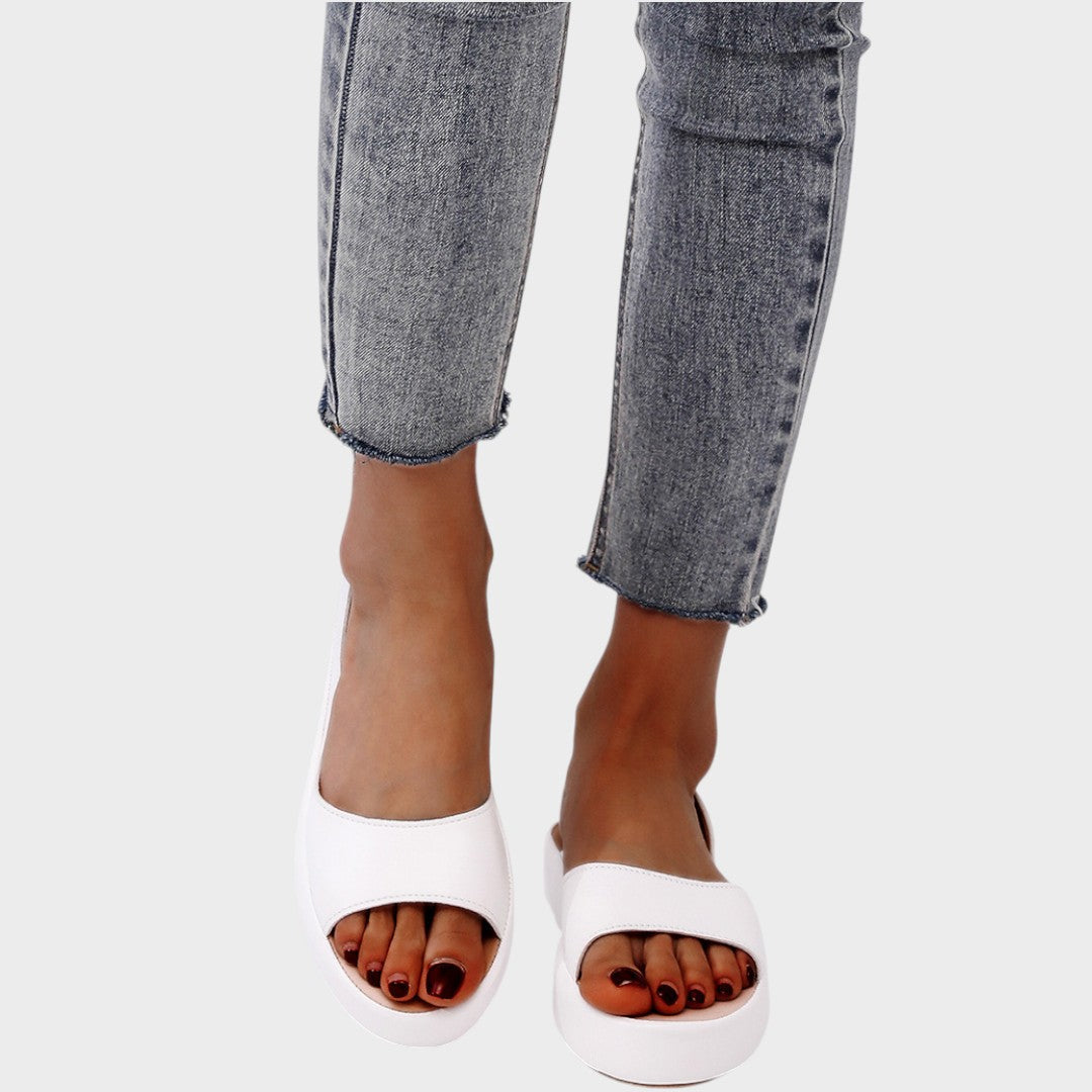 Yellow Caryzzaa™ orthopedic sandals by THE WHITMORE FAMILY with supportive straps and cushioned soles for comfort.
