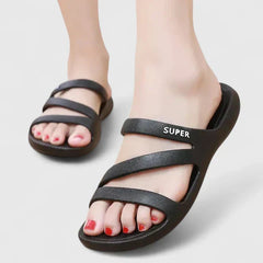 Black Daryell™ orthopedic sandals by THE WHITMORE FAMILY featuring supportive straps and cushioned soles for comfort.