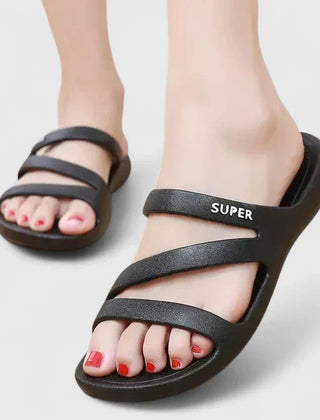 Black Daryell™ orthopedic sandals by THE WHITMORE FAMILY featuring supportive straps and cushioned soles for comfort.