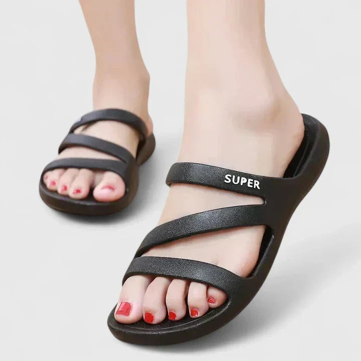 Black Daryell™ orthopedic sandals by THE WHITMORE FAMILY featuring supportive straps and cushioned soles for comfort.
