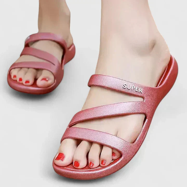 Black Daryell™ orthopedic sandals by THE WHITMORE FAMILY, featuring supportive straps and cushioned soles.