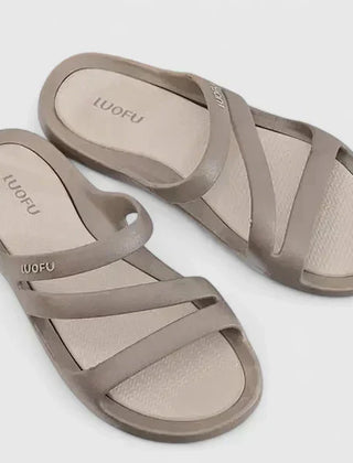 Black Daryell™ orthopedic sandals by THE WHITMORE FAMILY, featuring supportive straps and cushioned soles for comfort.