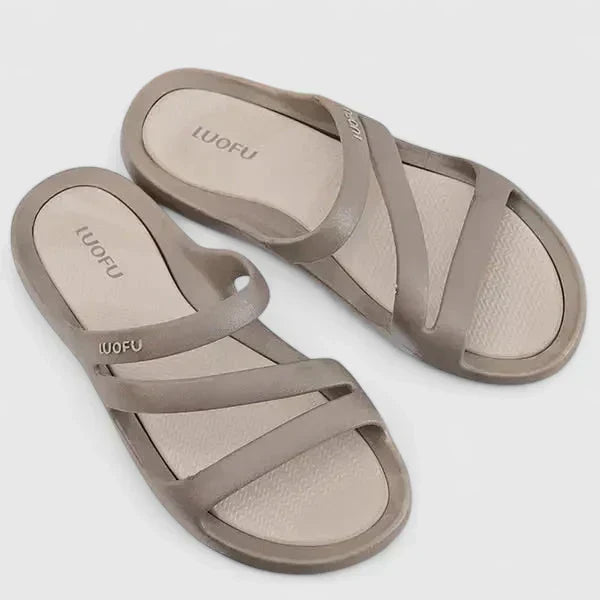 Black Daryell™ orthopedic sandals by THE WHITMORE FAMILY, featuring supportive straps and cushioned soles for comfort.