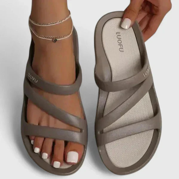 Black Daryell™ orthopedic sandals by THE WHITMORE FAMILY featuring cushioned soles and supportive design.