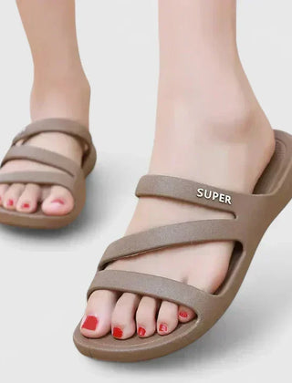Black Daryell™ orthopedic sandals from THE WHITMORE FAMILY with cushioned soles and adjustable straps for comfortable support.