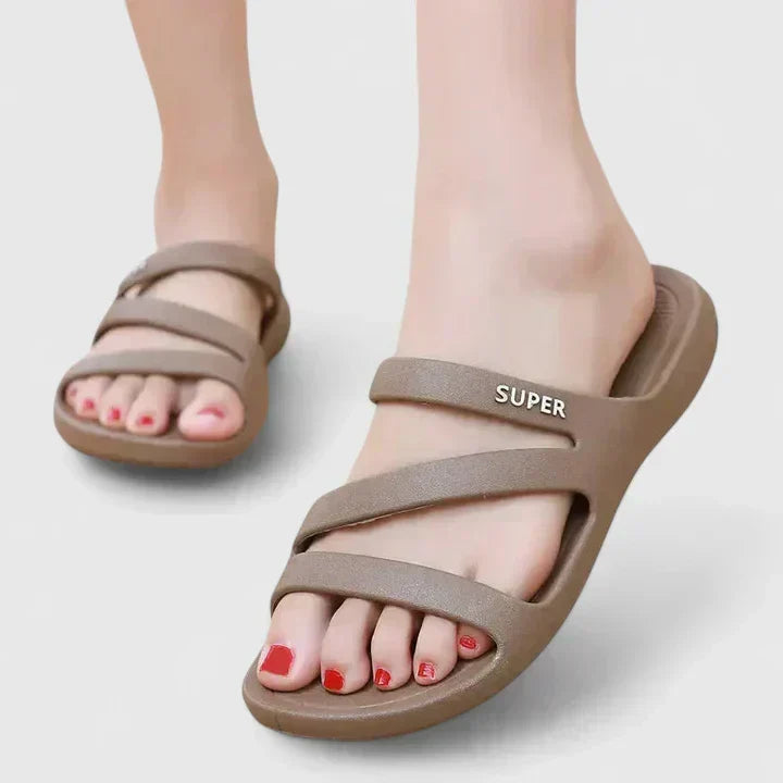 Black Daryell™ orthopedic sandals from THE WHITMORE FAMILY with cushioned soles and adjustable straps for comfortable support.