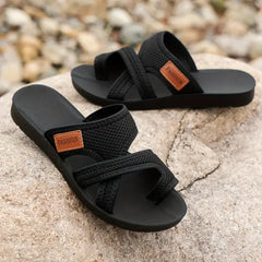 Black Natalie™ orthopedic sandals by THE WHITMORE FAMILY, stylish slip-on shoes with supportive footbed for comfort.