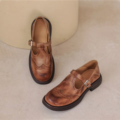 Brown Matea elegant Mary Janes shoes by THE WHITMORE FAMILY with a classic design and polished finish.