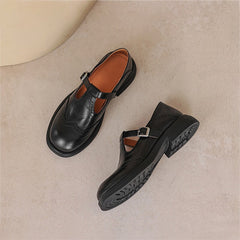 Brown Matea elegant Mary Janes shoes by THE WHITMORE FAMILY with classic strap and comfortable design, ideal for stylish everyday wear.