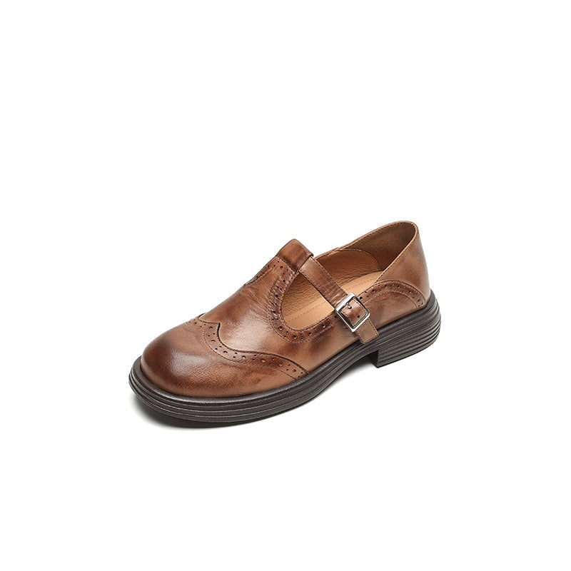Brown Matea elegant Mary Janes shoes by THE WHITMORE FAMILY, featuring classic design and polished leather finish.