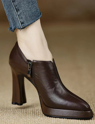 Brown Carina™ stylish pumps from THE WHITMORE FAMILY, elegant shoes with a sleek design and pointed toe.