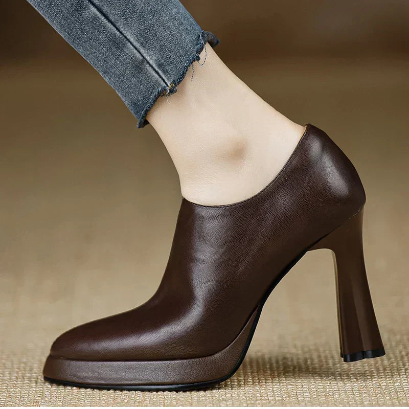 Brown Carina™ stylish pumps by THE WHITMORE FAMILY, elegant shoes and sandals with a sleek design and pointed toe.