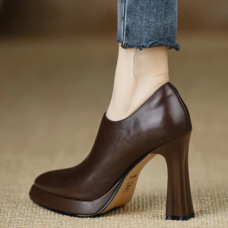 Brown Carina™ stylish pumps from THE WHITMORE FAMILY, elegant shoes with a sleek design perfect for dressy occasions.
