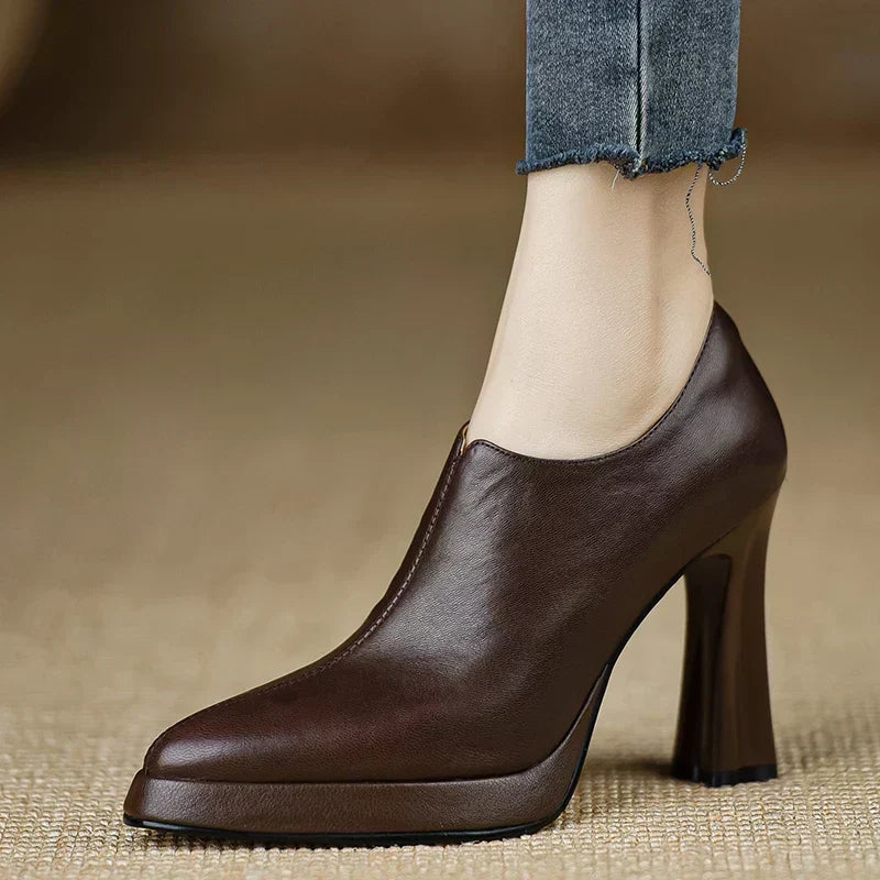 Brown Carina™ stylish pumps by THE WHITMORE FAMILY, elegant shoes with a sleek design and comfortable fit.