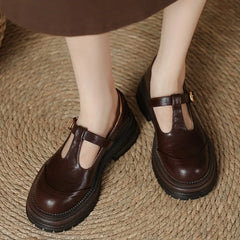 Brown Farisse T-bar Mary Janes shoes by THE WHITMORE FAMILY featuring classic T-strap design and comfortable footwear style.
