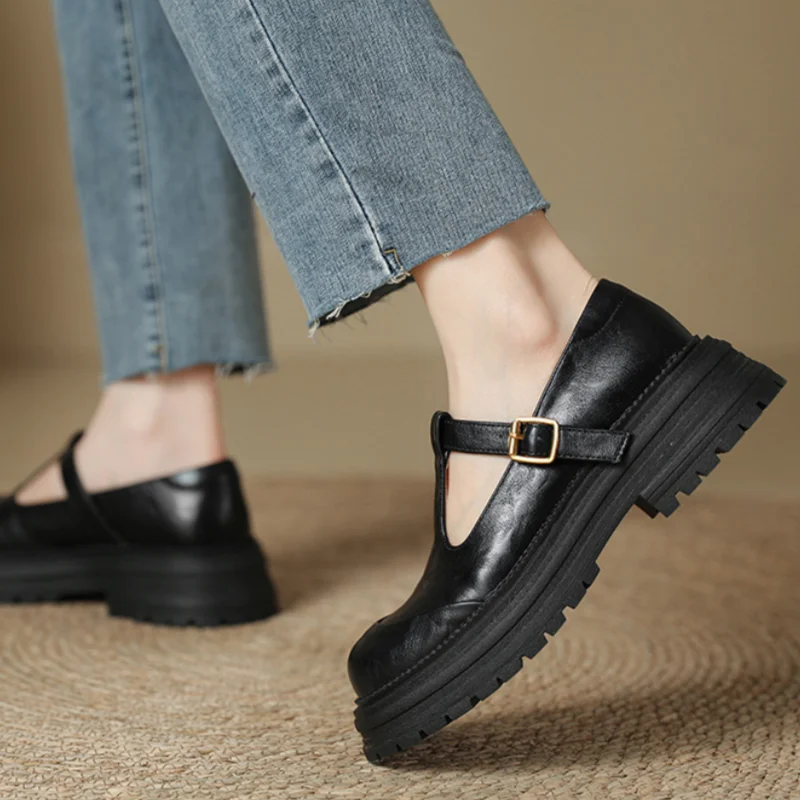 Brown Farisse T-bar Mary Jane shoes by THE WHITMORE FAMILY featuring classic design and comfortable strap for girls' footwear.