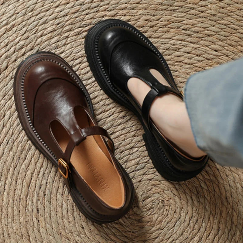 Brown Farisse T-bar Mary Jane shoes by THE WHITMORE FAMILY, featuring classic T-strap design and comfortable leather material.