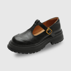 Brown Farisse T-bar Mary Jane shoes by THE WHITMORE FAMILY, featuring classic T-strap design and comfortable footwear style.