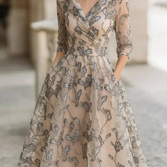 Marceline classic graceful short sleeve midi dress in apricot from THE WHITMORE FAMILY, styled for a sophisticated look.