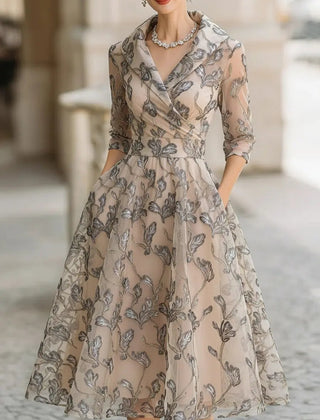 Marceline classic graceful short sleeve midi dress in apricot from THE WHITMORE FAMILY, styled for a sophisticated look.