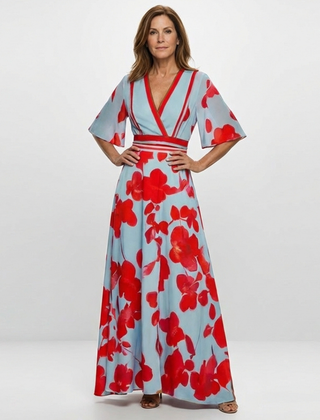 Corinne floral V-neck short sleeve maxi dress by THE WHITMORE FAMILY, featuring a vibrant floral pattern and flowing fabric.